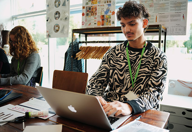Student on laptop in classroom