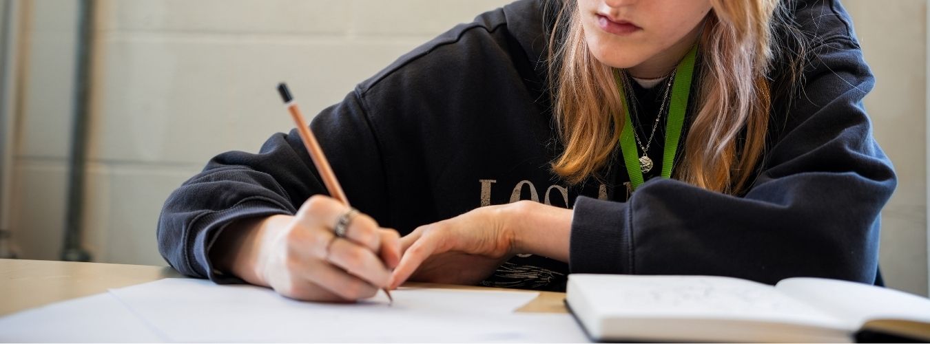 Student drawing on paper