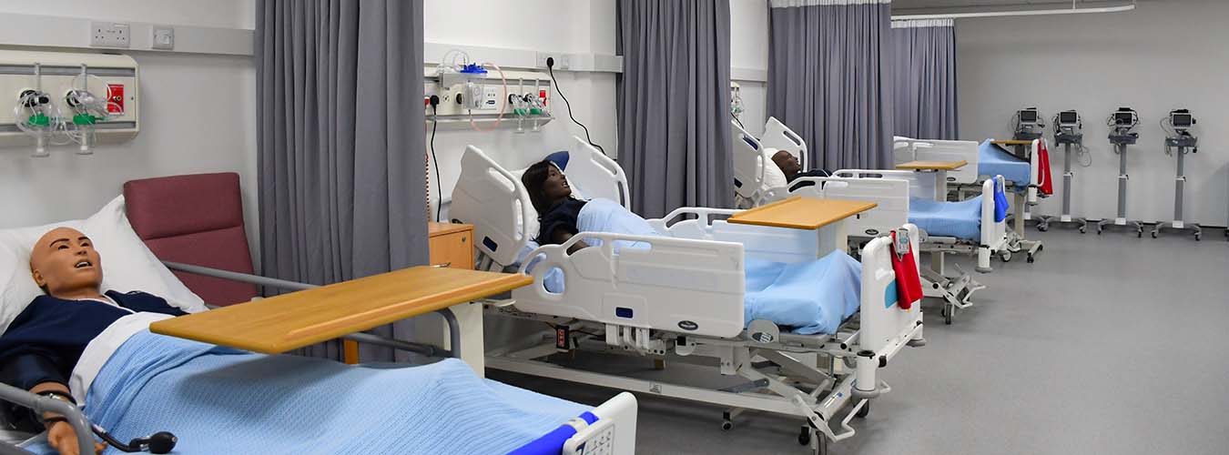Mock Hospital ward with mannequins on beds