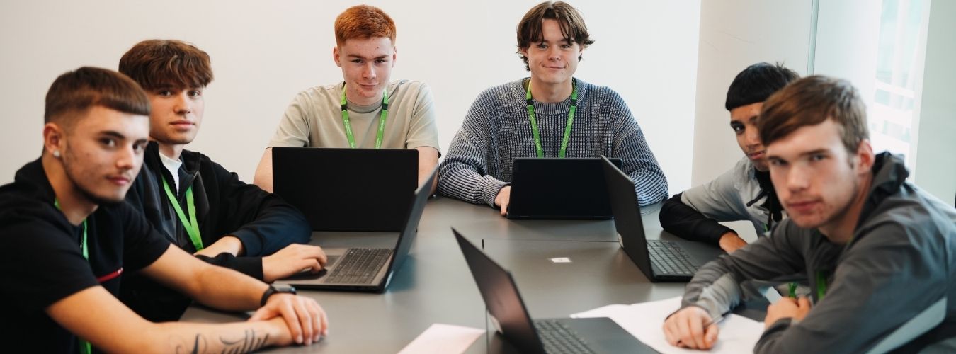 Students sitting around table 