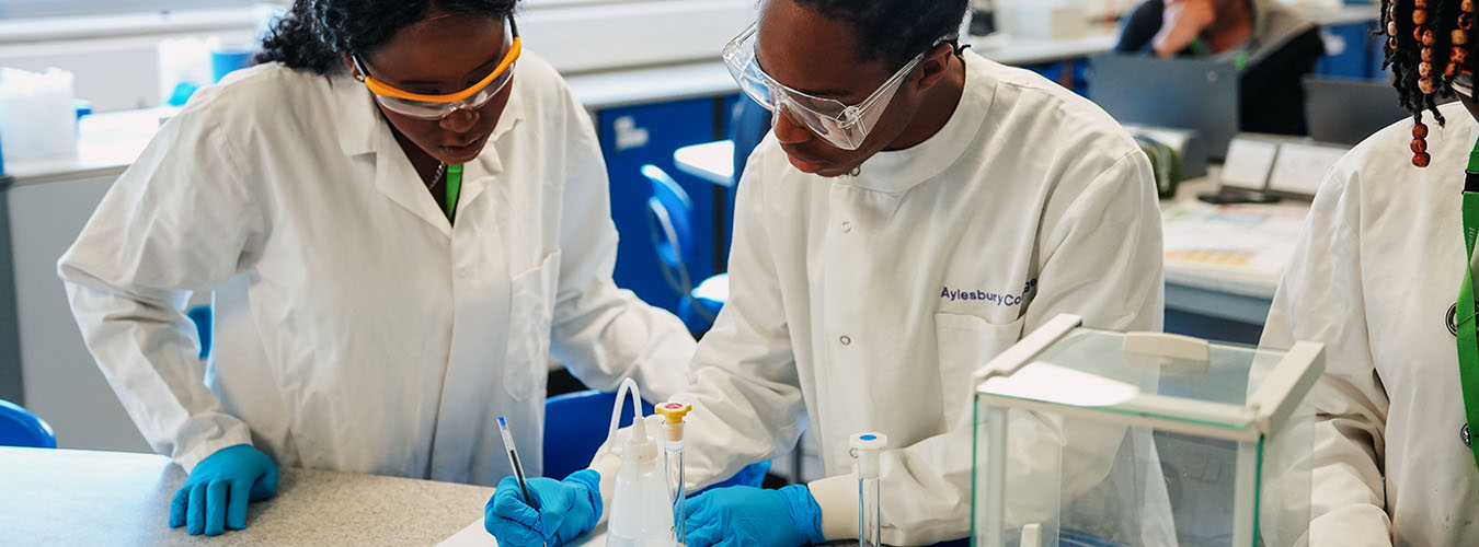 Student working in science lab wearing PPE