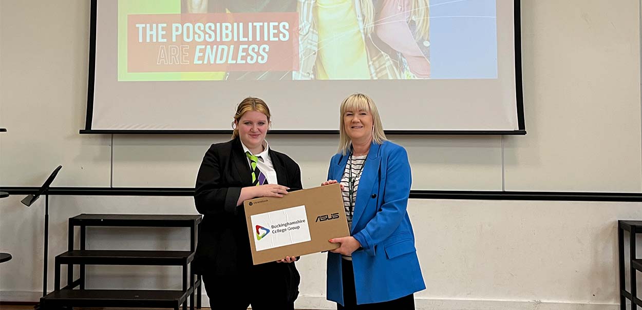 Student receiving Chromebook 